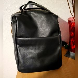 A new day backpack purse